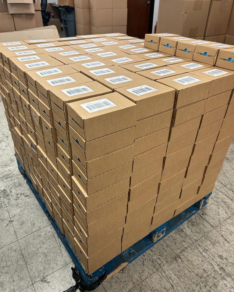 A pallet of case-packed, labelled stock in the Century Wholesales warehouse